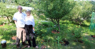 Hank and Vera Jones stand in their garden.