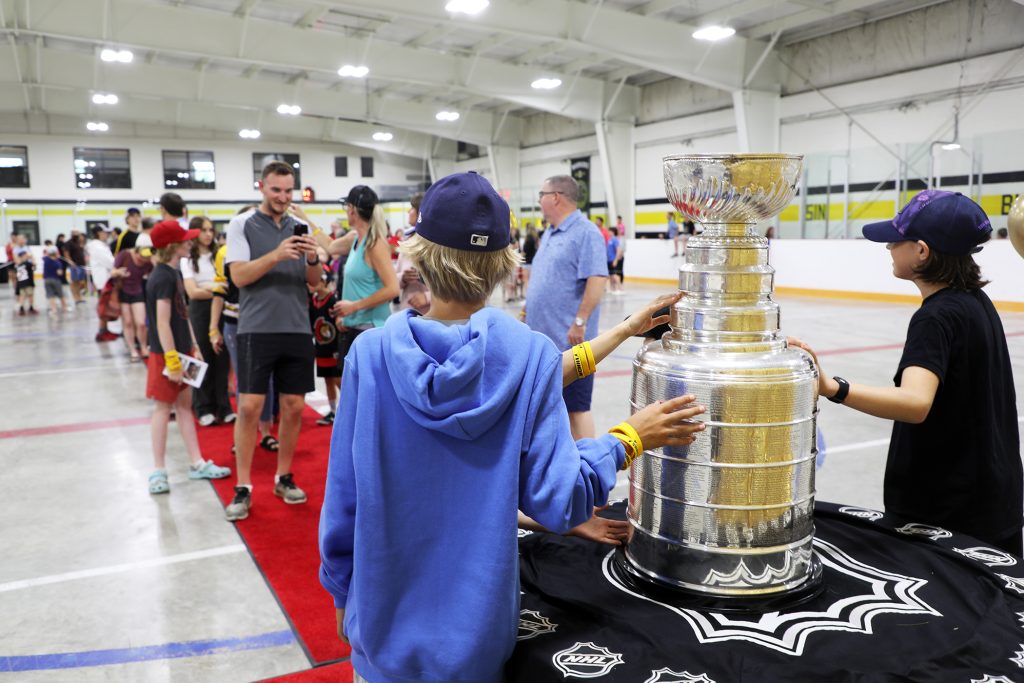 Kids pose with the Cup.