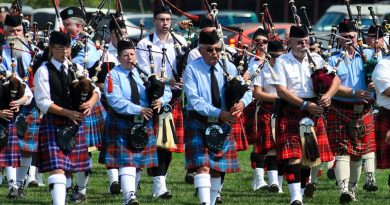 A photo of a highland pipes and drum band.