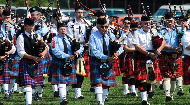 A photo of a highland pipes and drum band.