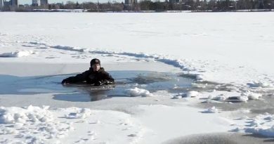 A screengrab if a firefighter broken through the ice.