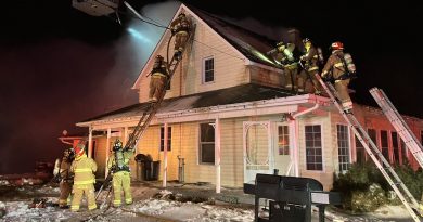 Firefighters battle a house fire.