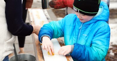 A boy works on making some taffy.