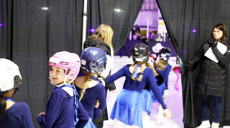 Skaters wait to hit the ice.