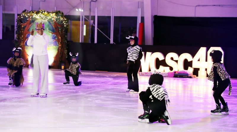 Skaters peform on the ice.
