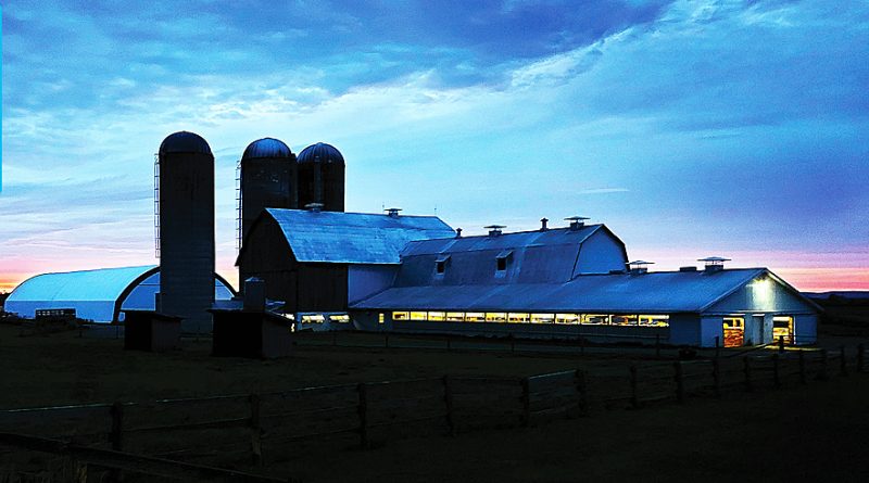 A photo of a barn at dusk.