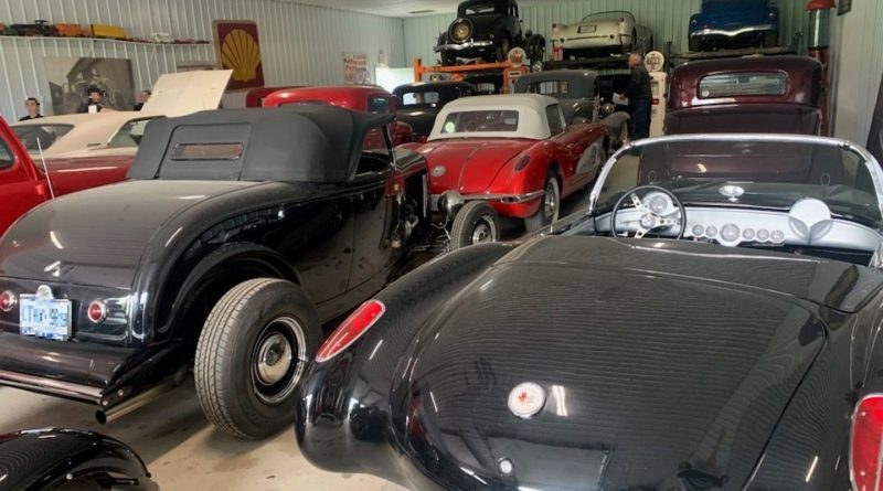 A photo of a bunch of cars in a garage.