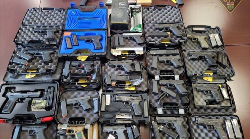 A photo of guns in cases.