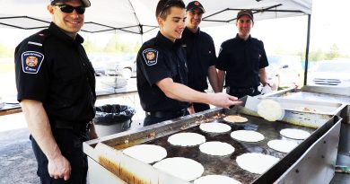Firefighters make pancakes.