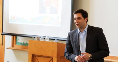 A person speaks at a podium.