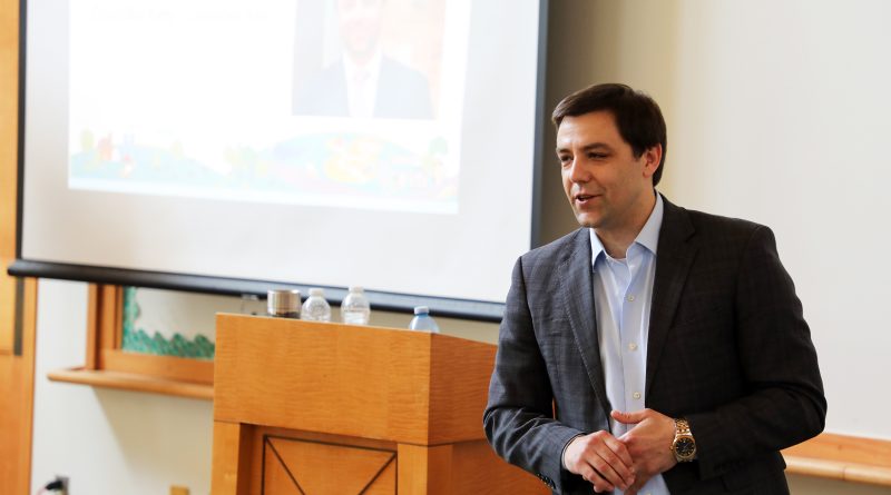 A person speaks at a podium.