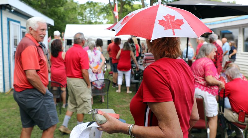 A group of people celebrate Canada Day.