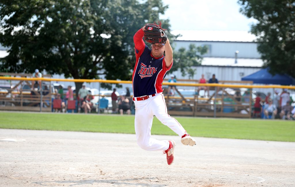 A pitcher delivers a strike.