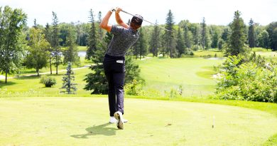 A golfer tees off at Eagle Creek.