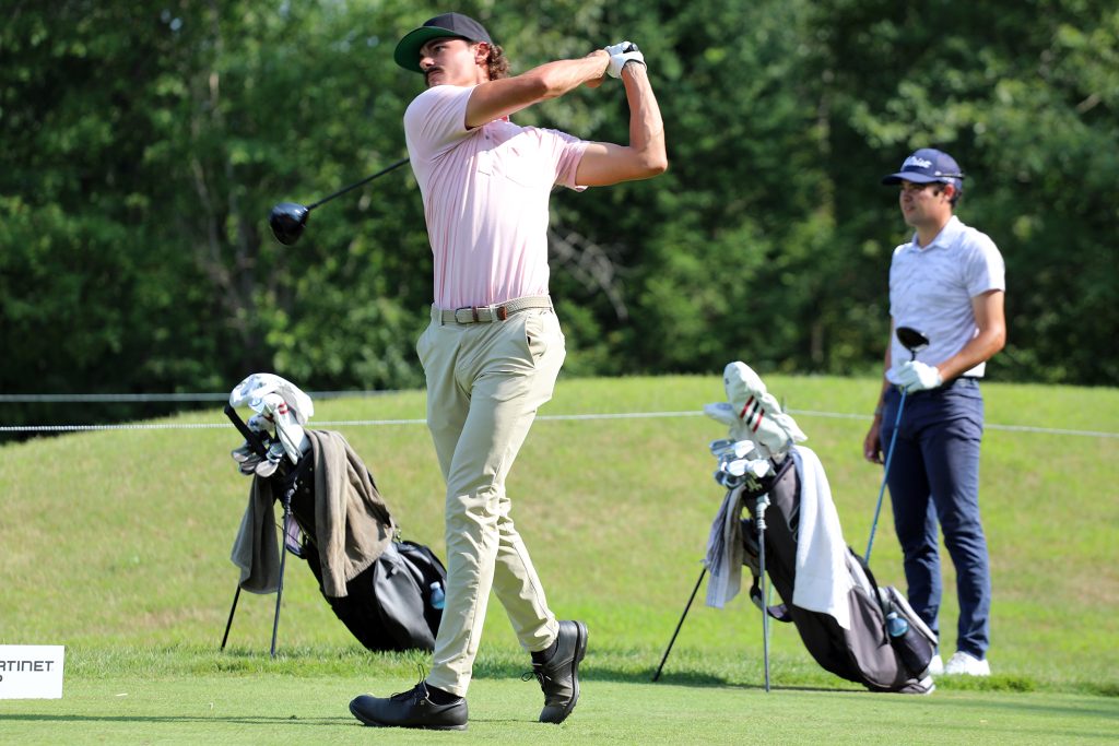 A player tees off Hole 9.