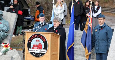 A woman speaks at a podium.