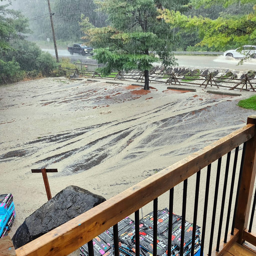 A photo of a parking lot getting washed out.