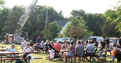 A photo of a picnic at a fire hall.