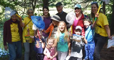 A group of wild children and their handlers pose for a photo.