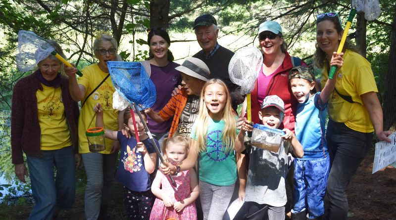 A group of wild children and their handlers pose for a photo.