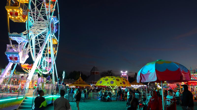 A night photo of the Carp Fair midway.