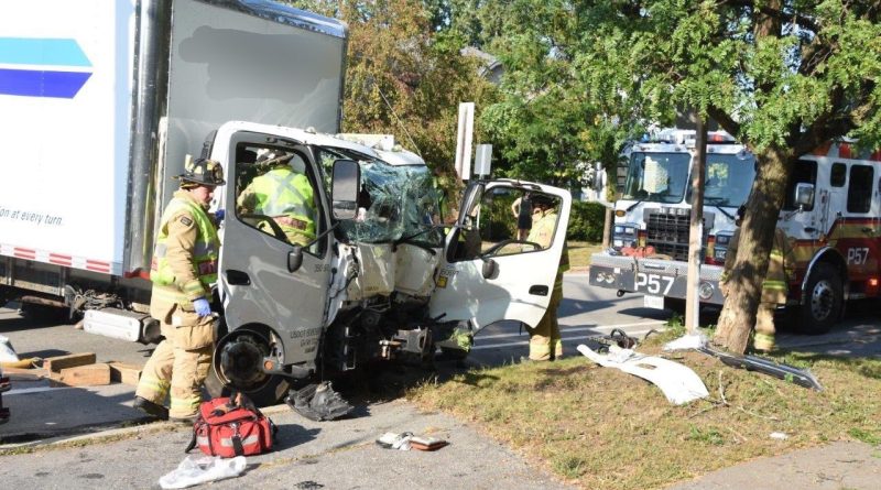 Firefighters rescue a motorist.