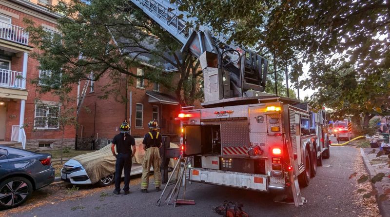 A fire truck parked outside a building.