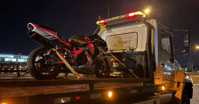 A photo of a bike on a tow truck.