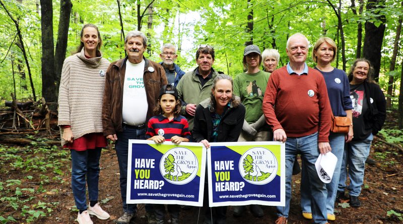 A photo of a group in the forest.