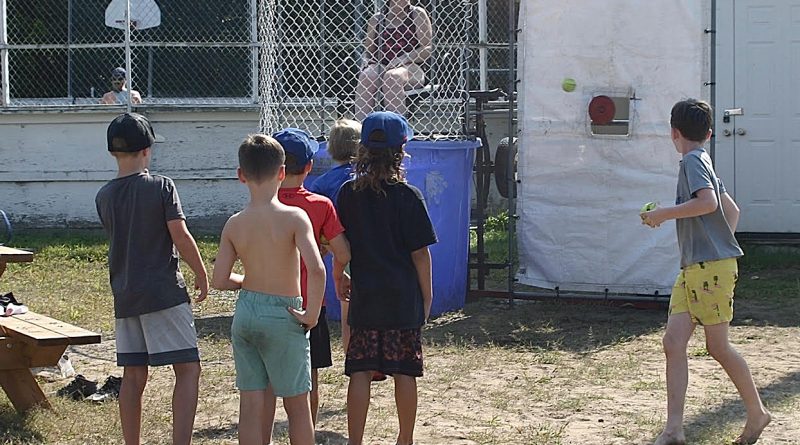 Boys line up for the dunk tank.