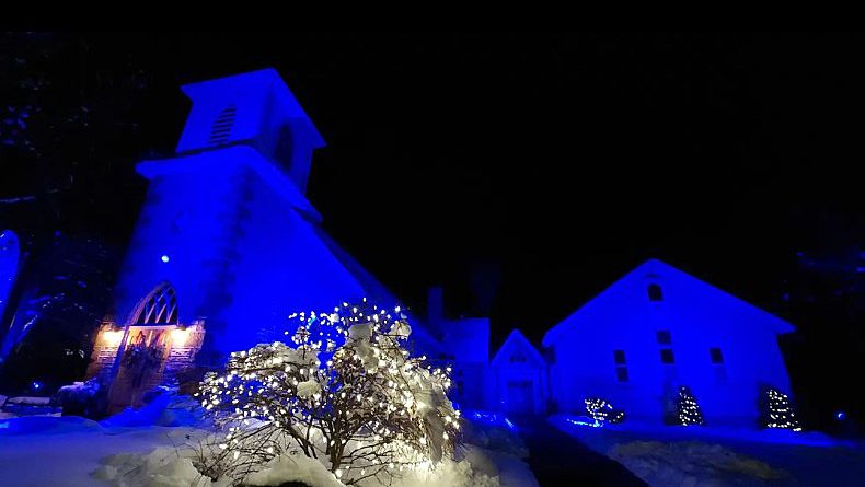 A photo of a blue chruch.