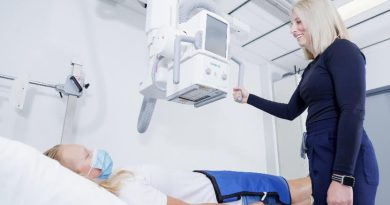 A technician does some imaging of a patient.