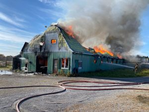 Firefighter battle a raging barn fire.