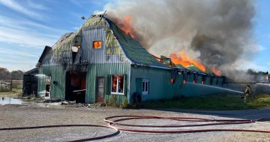 Firefighter battle a raging barn fire.