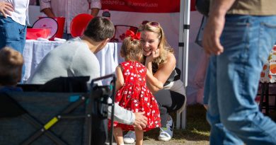 Jenna Sudds talks to a child at the Carp Fair.