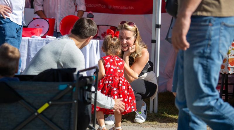 Jenna Sudds talks to a child at the Carp Fair.