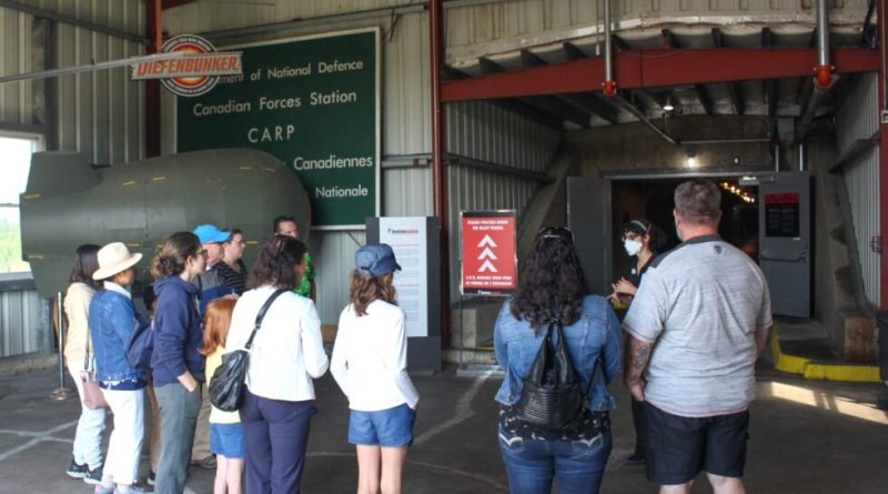 People stand in the entrance to the museum.