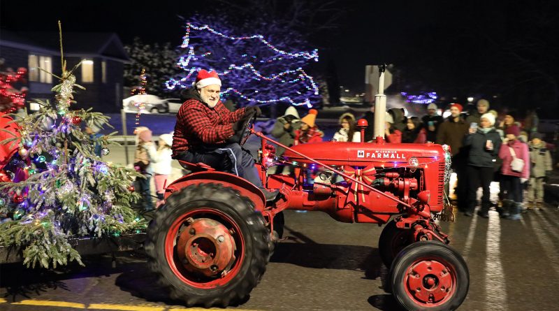 Santa drives a tractor.