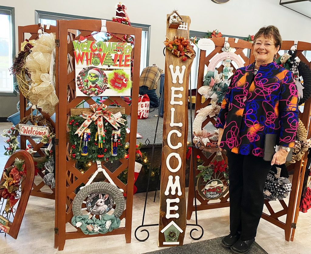 A artisan poses with her product.