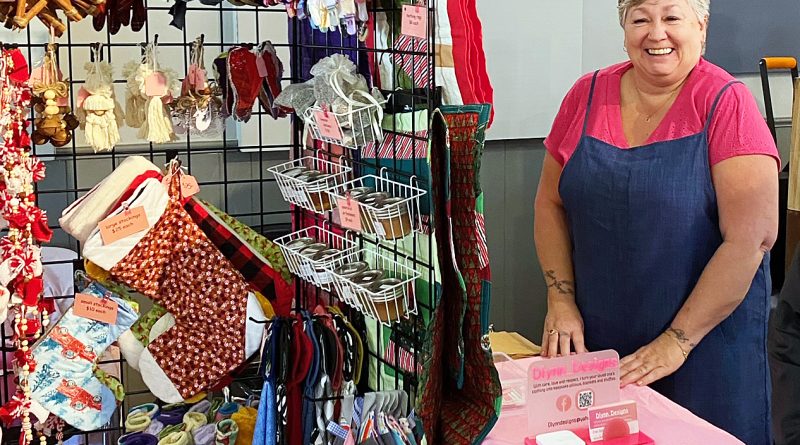 A woman poses with her products.