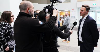 A man speaks to the media.