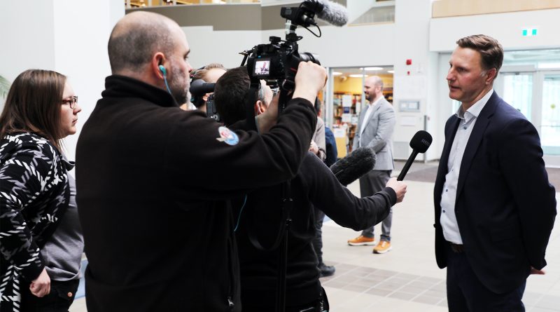 A man speaks to the media.