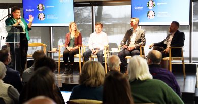 Five people speak as part of a panel.