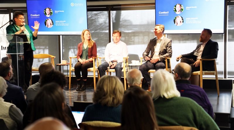 Five people speak as part of a panel.