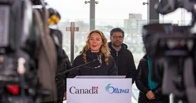 A woman speaks at a podium.