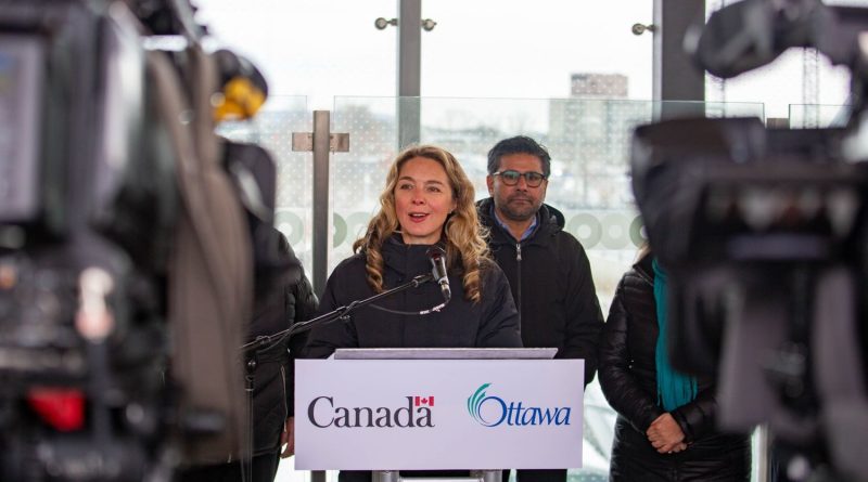 A woman speaks at a podium.