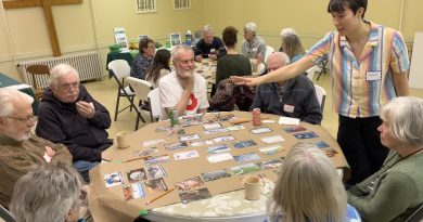 A photo of people playing a board game.