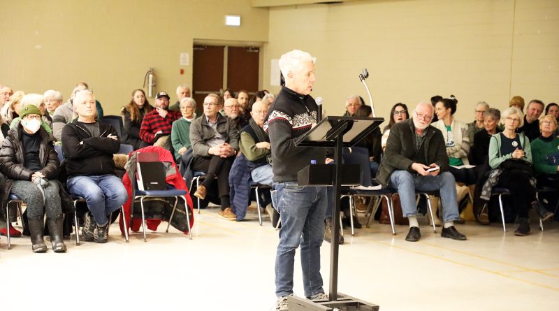 A person speaks at a committee of adjustment meeting.