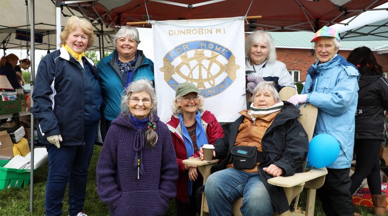 A froup of women pose for a photo.