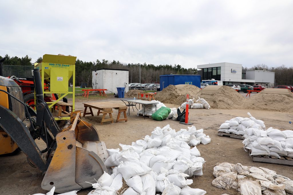 A photo of sand and sandbag filling equipment.